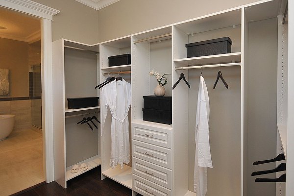 Custom storage and bedroom closet organizers by YYC Closets & Glass